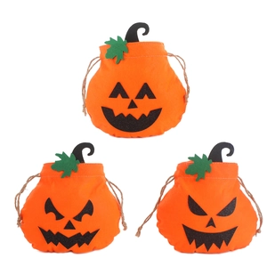 Set of three orange pumpkin drawstring bags with black jack-o'-lantern faces for Halloween