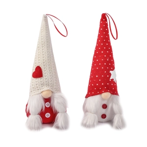 Pair of red and white Christmas gnome plush ornaments with knit hats and heart patterns