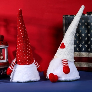 Standing Christmas faceless gnome dolls with red and white knit hats for holiday decoration