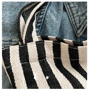 Close-up of durable black and white striped canvas fabric with high quality stitching