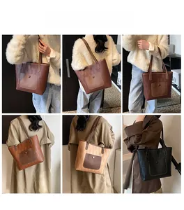 Detailansicht der gewebten Tote-Bags in Braun und Schwarz an einem Lifestyle-Modell