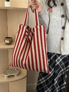 Chic red and white vertical striped canvas tote bag with large capacity and dual handles