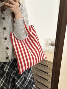 Minimalist red and white striped canvas tote bag for women featuring a spacious casual design