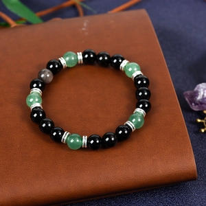 Obsidian beaded planet bracelet with green stone and silver spacers on leather