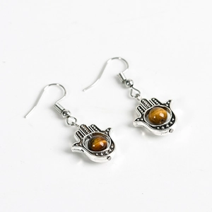 Silver Hamsa Hand earrings with natural brown tiger eye stone beads on white background