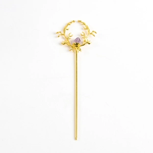 Golden branch hair pin featuring natural purple crystal in an elegant retro aesthetic