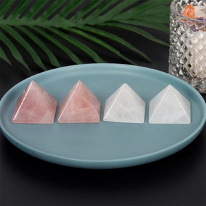 Polished natural rose quartz and white crystal pyramid ornaments for home decor