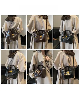 Vues détaillées du sac seau vintage avec logo métallique en noir et marron