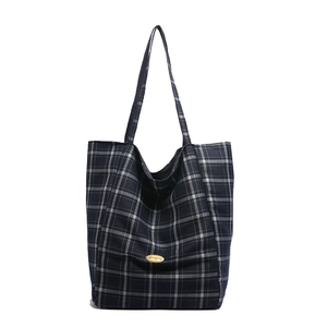 Classic navy blue plaid canvas tote bag with spacious design and golden metal plaque