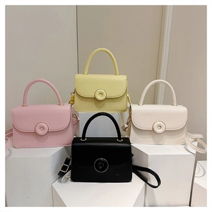 Four minimalist square leather handbags in pastel tones displayed on geometric pedestals