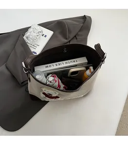 Top view of spacious beige canvas tote bag showing storage for umbrella and essentials