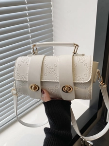 White floral embossed crossbody bag with gold hardware and top handle for women