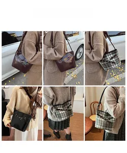 Three retro style tote bags in brown, black leather and green plaid finish detail