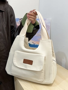 Minimalist off-white canvas tote bag with fashion leather patch and large capacity