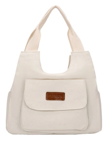 Minimalist white canvas tote bag for women with front pocket and leather fashion label