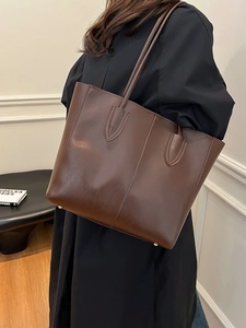 Classic dark brown leather tote bag for women with large capacity and bottom metal studs