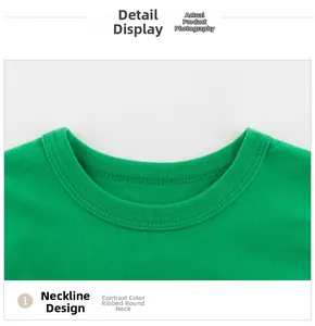 Detail shot of the ribbed neckline and stitching on a green cotton kid's t-shirt