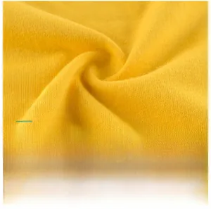 Detail of yellow cotton knit fabric showing soft texture and skin-friendly breathability