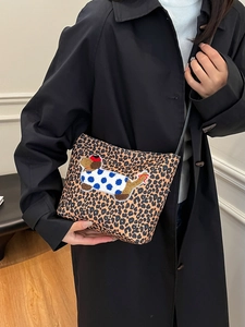 Leopard print bucket bag with colorful dog embroidery and slim shoulder strap