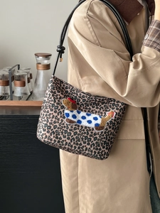 Leopard print bucket bag with dachshund embroidery and black leather strap for autumn