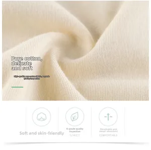 Gros plan sur le tissu en maille de coton crème montrant la texture douce et qualité A