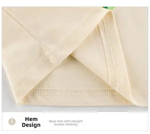 Vue macro de la couture double et de l'ourlet soigné sur un t-shirt beige pour enfant