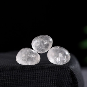 Set of three polished clear white quartz tumble stones for healing and home decor