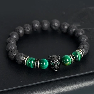 Men's volcanic lava stone bead bracelet with green malachite and a black wolf head charm