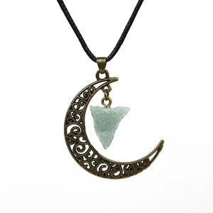 Vintage bronze crescent moon necklace with green natural raw crystal and black cord strap