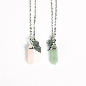 Vertical display of pink and green crystal column necklaces with Best Friend heart charms