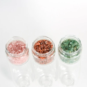 Portable crystal energy glass bottles with bamboo lids and natural stone fillings