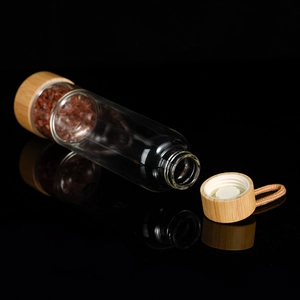Bamboo lid glass water bottle with crystal infusion compartment and portable strap