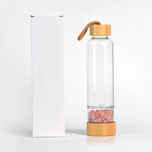 Eco-friendly glass water bottle with bamboo lid and pink crystal quartz infusion stones