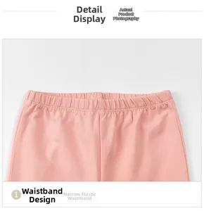 Dettaglio di leggings in cotone rosa con vita elastica stretta e cuciture piatte