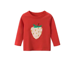Detail of red kids long sleeve tee featuring a cute cartoon strawberry print