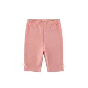 Girls' coral pink cotton cycling shorts with elastic waist and side ribbon bows