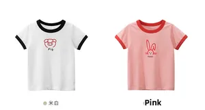 Flat lay detail of cotton t-shirts with pig and rabbit prints and contrast necklines