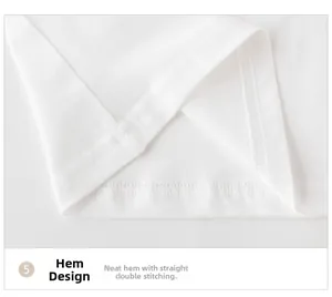 Detail of neatly stitched double-line hem on white cotton long-sleeve toddler T-shirt