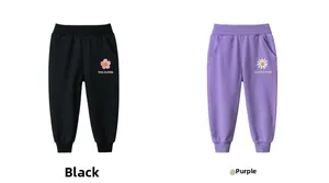 Detail of girls' black and purple jogger pants featuring cute floral prints and elastic cuffs