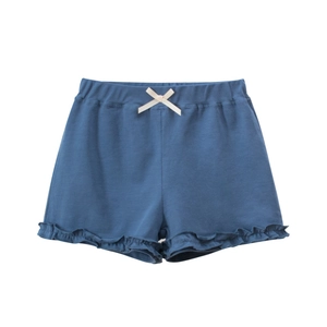 Short fille bleu marine avec ourlet à volants, taille élastique et nœud crème