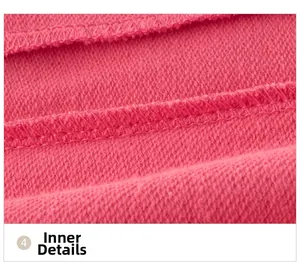 Macro shot of rose pink knit fabric showing detailed stitching and soft cotton loop lining