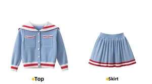Flat lay of girl's knit set featuring blue sailor cardigan and pleated skirt