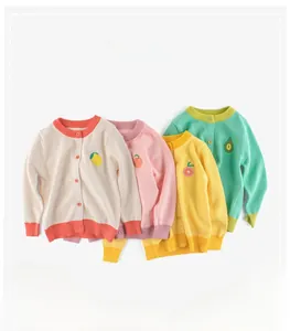 Detail of knit baby cardigans with colorful fruit embroidery and contrast ribbing