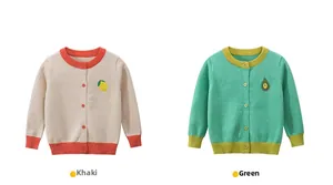 Detail of knit cardigans with lemon and avocado embroidery in khaki and green