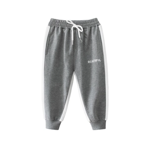 Girls gray sporty joggers with white side stripes and 'BEAUTIFUL' embroidery detail
