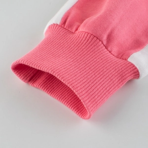 Girl's pink cotton tracksuit top featuring ribbed cuffs and white sporty side stripes