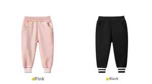 Detail of kids pink and black fleece jogger pants with elastic waist and striped ribbed cuffs