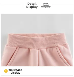 Pink girl's jogging pants detail showing elastic ribbed waistband and side pockets