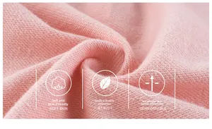 Close-up of pink knit fabric showing soft texture and breathable cotton quality