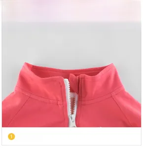 Detail view of pink cotton jacket neckline with protective zipper guard and soft fabric